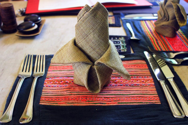 A delicately folded tablecloth tells you their uniqueness